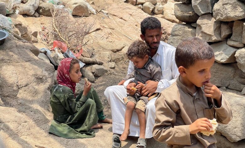yemen. abdullatif, 35, with his children, fatima,7, ali, 6, and jalal,1