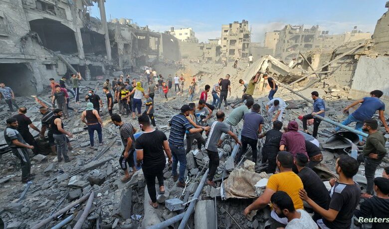 palestinians search for casualties at the site of israeli strikes on houses in jabalia refugee camp
