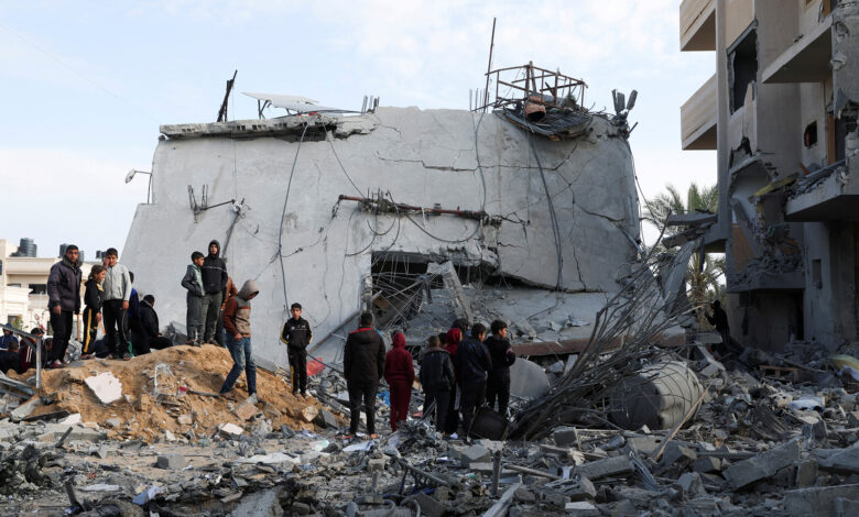 file photo: palestinians gather near a house hit by an israeli strike, in rafah in the southern gaza strip